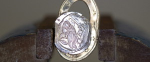 Squashed Greek 1 Euro Coin In A Vice.