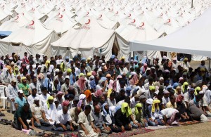 Syrian refugees attend Friday prayers at a refugee camp in the Turkish border town of Boynuyogun in Hatay province