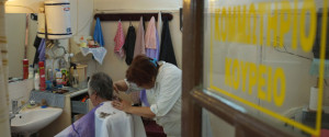 EDESSA, GREECE - JUNE 17: An elderly woman gets a haircut during the parliament elections on June 17, 2012 in Foustani near Edessa, Greece.The Greek electorate go to the polls today in a re-run of the general election after no combination of political parties were able to form a coalition government. Recent opinion polls have placed the anti-bailout party 'Syriza' equal in popularity with the pro-bailout 'New Democracy' in a vote which could determine whether Greece retains the Euro as its currency. (Photo by Vladimir Rys Photography/Getty Images)