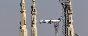 An EgyptAir plane flies past minarets of a mosque as it approaches Cairo International Airport, in Cairo, Egypt, Saturday, May, 21, 2016. Smoke was detected in multiple places on EgyptAir flight 804 moments before it plummeted into the Mediterranean last Thursday, but the cause of the crash that killed all 66 on board remains unclear, the French air accident investigation agency said on Saturday. (AP Photo/Amr Nabil)