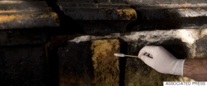 A Greek expert works on the renovation of Jesus' tomb in the Church of the Holy Sepulchre in Jerusalem's old city, Monday, June 6, 2016. A team of experts has begun a historic renovation at the spot where Christians believe Jesus was buried, overcoming longstanding religious rivalries to carry out the first repairs at the site in over 200 years. (AP Photo/Ariel Schalit)