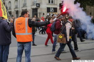 An employee of French state-owned railway company SNCF attends a demonstration to protest the government's proposed labour law reforms in Nantes, France, June 2, 2016. REUTERS/Stephane Mahe