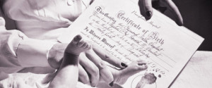IMPRINTING BABYS FOOT ON CERTIFICATE