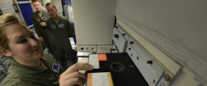 GREAT FALLS, MONTANA, 2014 - Missile combat crew member 1st Lt. Katie Grimley slides a large floppy disk into a 60's era communication module inside the launch control center of a missile alert facility at Malmstrom Air Force Base. The U.S. govt. is embarking on a $400 billion modernization to its nuclear weapons arsenal. (Photo by Robert Gauthier/Los Angeles Times via Getty Images)