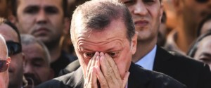 Turkey's President Recep Tayyip Erdogan (C) reacts after attending the funeral of a victim of the coup attempt in Istanbul on July 17, 2016. Turkish President Recep Tayyip Erdogan vowed today to purge the "virus" within state bodies, during a speech at the funeral of victims killed during the coup bid he blames on his enemy Fethullah Gulen. / AFP / BULENT KILIC (Photo credit should read BULENT KILIC/AFP/Getty Images)