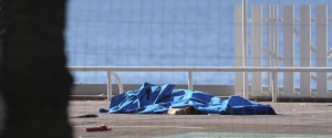 Bodies of victims covered by sheets at the scene of a truck attack in Nice, southern France, Friday, July 15, 2016. A large truck mowed through revelers gathered for Bastille Day fireworks in Nice, killing more than 80 people and sending people fleeing into the sea as it bore down for more than a mile along the Riviera city's famed waterfront promenade. (AP Photo/Luca Bruno)
