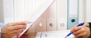 Inspector and auditor are inspecting legal and financial documents