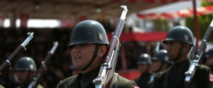 Turkish soldiers take part in the annual military parade, the highlight of celebrations marking the 42nd anniversary of the 1974 Turkish invasion, in the Turkish-controlled northern part of Nicosia in this ethnically divided island of Cyprus, on Wednesday, July 20, 2016. This year's parade was a muted affair with neither warplanes nor heavy battle tanks making an appearance following a decision by Turkish Cypriot leaders and army commanders to keep celebrations low key in the wake of the failed coup in Turkey. (AP Photo/Petros Karadjias)