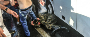 People kick and beat a Turkish soldier that participated in the attempted coup, on Istanbul's Bosporus Bridge, Saturday, July 16, 2016. Turkish President Recep Tayyip Erdogan told the nation Saturday that his government was working to crush a coup attempt after a night of explosions, air battles and gunfire across the capital that left dozens dead and scores wounded. Government officials said the coup appeared to have failed as Turks took to the streets overnight to confront troops attempting to take over the country. (AP Photo/Selcuk Samiloglu)