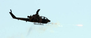 A combat Cobra helicopter fires during an Efes-2009 Military Exercise in Izmir on May 26, 2009. Turkish Prime minister Recep Tayyip Erdogan and Chief of Staff General Ilker Basbug attended the exercises. AFP PHOTO/ADEM ALTAN (Photo credit should read ADEM ALTAN/AFP/Getty Images)