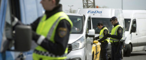 Austrian policemen check vehicles on the Austrian side of the Hungarian-Austrian border near Nickelsdorf, 70 kms southeast of Vienna, Monday, April 25, 2016. Austria has re-imposed controls on its border with Hungary, with police checking vehicles at the main regular crossings and soldiers patrolling other stretches of the border. Police say the controls that began Monday are meant to ensure that no one crosses illegally and to prevent the smuggling of migrants into Austria and other EU nations. They have reported more such smuggling attempts into Austria since countries along the Balkan migration route closed their borders to migrants earlier this year. (Szilard Koszticsak/MTI via AP)