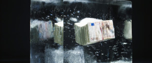 50 EUR money bundle being frozen in an ice block.