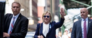US Democratic presidential nominee Hillary Clinton waves to the press as she leaves her daughter's apartment building after resting on September 11, 2016 in New York. Clinton departed from a remembrance ceremony on the 15th anniversary of the 9/11 attacks after feeling "overheated," but was later doing "much better," her campaign said. / AFP / Brendan Smialowski (Photo credit should read BRENDAN SMIALOWSKI/AFP/Getty Images)