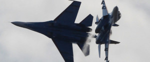 Su-27 jet of the aerobatics team Russkiye Vityasy (Russian Knights) perform at an air show at the International Maritime Defence show in St.Petersburg, Russia, Thursday, July 4, 2013. (AP Photo/Dmitry Lovetsky)