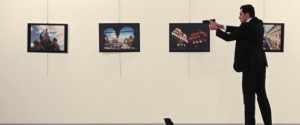 EDITORS NOTE: Graphic content / This picture taken on December 19, 2016 shows Andrey Karlov (bottom), the Russian ambassador to Ankara, lying on the floor after being shot by a gunman (R) during an attack during a public event in Ankara. A gunman crying "Aleppo" and "revenge" shot Karlov while he was visiting an art exhibition in Ankara on December 19, witnesses and media reports said. The Turkish state-run Anadolu news agency said the gunman had been "neutralised" in a police operation, without giving further details. / AFP / Hurryet / Hasim KILIC / Turkey OUT (Photo credit should read HASIM KILIC/AFP/Getty Images)