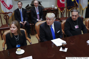 U.S. President Donald Trump, center, Mary Barra, chief executive officer of General Motors Co. (GM), left, and Sergio Marchionne, chief executive officer of Fiat Chrysler Automobiles NV, listen during a meeting at the Roosevelt Room of the White House in Washington, D.C., U.S., Jan. 24 2017. Trump told chief executives of the three biggest U.S. automakers that environmental regulations are "out of control" and promised he would remove obstacles for manufacturers and oil companies. Photographer: Shawn Thew/Pool via Bloomberg