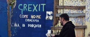 A man walks past a slogan on a wall in central Athens on February 20, 2017. Eurozone finance ministers will on February 20 seek the outline of a deal to unblock bailout cash for Greece before fraught elections across Europe endanger a quick fix. / AFP / LOUISA GOULIAMAKI (Photo credit should read LOUISA GOULIAMAKI/AFP/Getty Images)