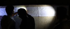 Iraqi Kurds check for their names on the voting lists posted outside a polling station in Arbil, the capital of the autonomous Kurdish region of northern Iraq, on the eve on the Kurdish independence referendum on September 24, 2017. / AFP PHOTO / SAFIN HAMED (Photo credit should read SAFIN HAMED/AFP/Getty Images)